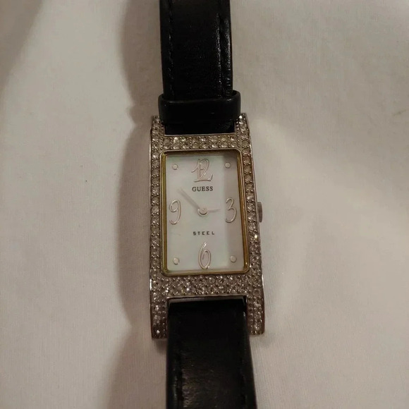 Guess tiny diamonds  and real mother of pearl face